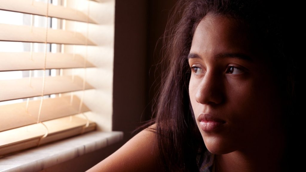 Person reflecting on recognizing inhalant use disorder and seeking help