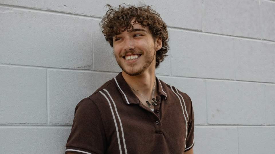what does recovery mean for your future a man smiling thinking about how far he has come from addiction